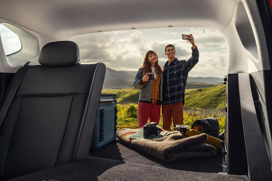 Trunk space in the 2026 Hyundai Kona Limited with the rear seat folded down on one side