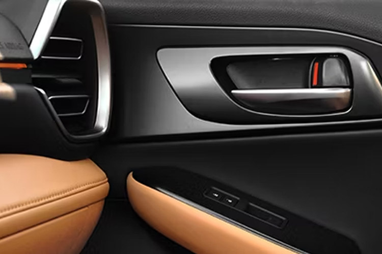 Close-up of the passenger-side door handle and air vents of a 2026 Lexus IS 350