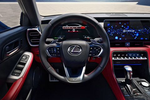 Close-up of the steering wheel and driver's instrument panel of the 2026 Lexus IS 350