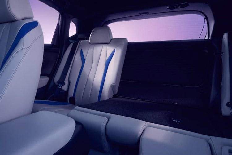 The trunk space of the 2026 Acura ADX with one rear seat folded down and the rear door closed