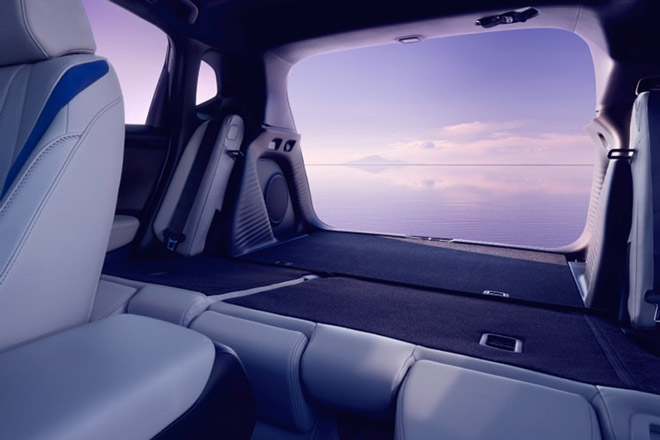 The trunk space of the 2026 Acura ADX with the rear seats folded down and the rear doors open