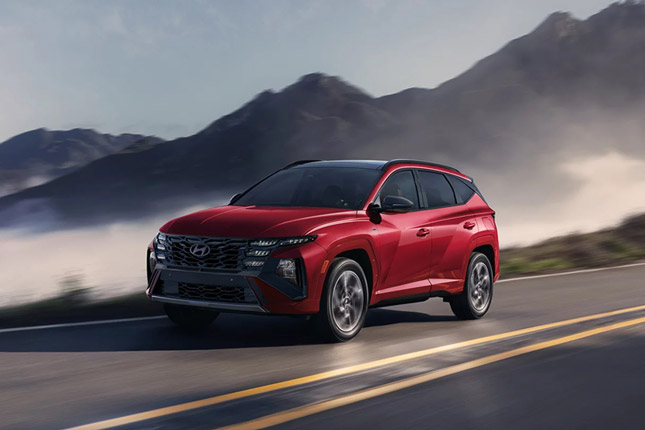 2026 Tucson Hybrid Front Three-Quarter View Driving